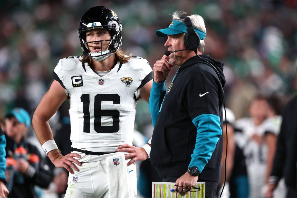 Trevor Lawrence (16) and head coach Doug Pederson of the Jacksonville Jaguars talk in the third quarter of a game against the Philadelphia Eagles at Lincoln Financial Field.