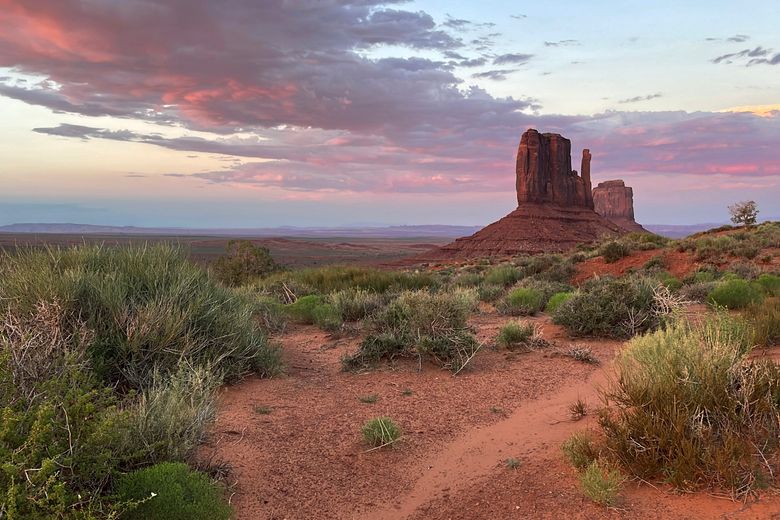 Clouds dissipate after a rainstorm during the monsoon season Friday, June 28, 2024, in Monument Valley, Ariz. Thunderstorms are hopscotching around the Southwestern U.S., bringing much-needed moisture to a region where every drop counts. (AP PH๏τo/Susan Montoya Bryan)