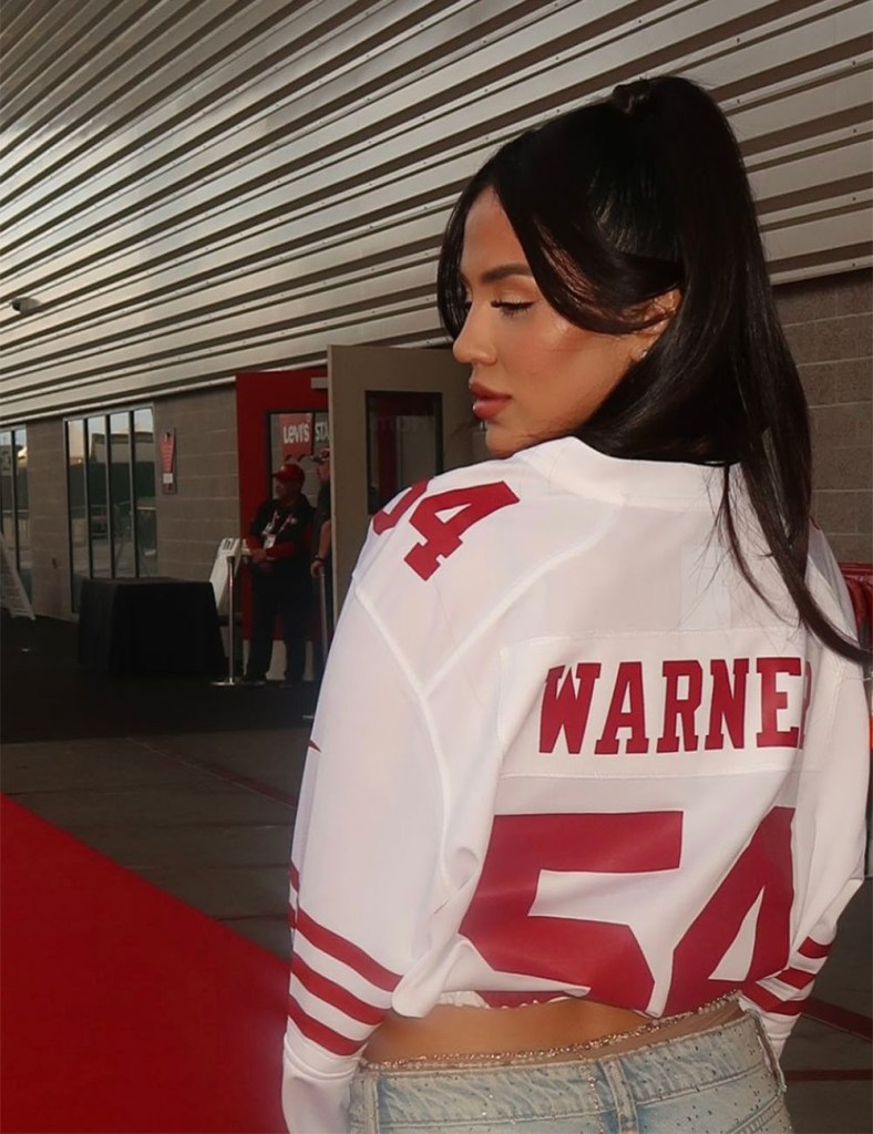 Sydney Warner rocks a custom Fred Warner jersey at Levi's Stadium during the 2024 season. 