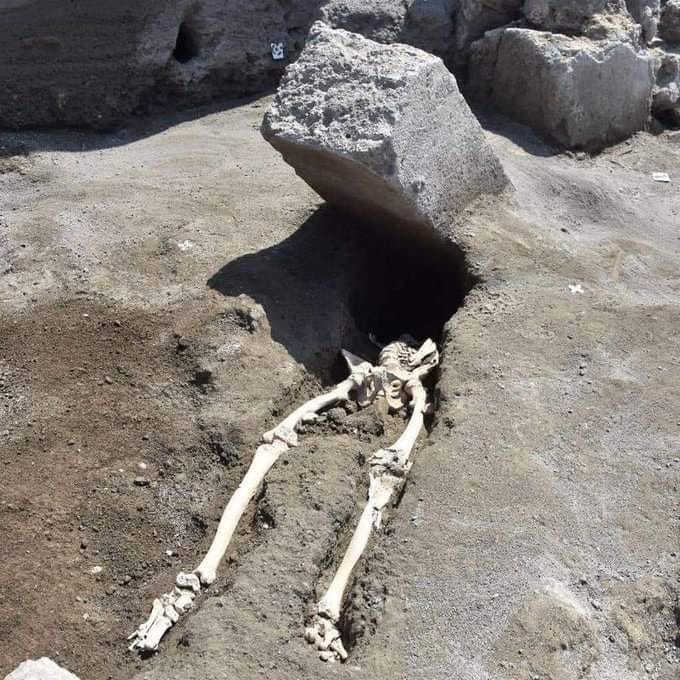 Unearthed from the ashes: The skeleton of a Roman man crushed by a stone slab during the eruption of Mount Vesuvius nearly 2,000 years ago.