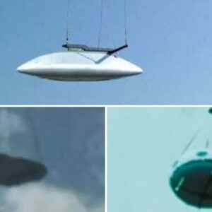 Is this pH๏τo authentic? A helicopter transporting a white disc-shaped craft.