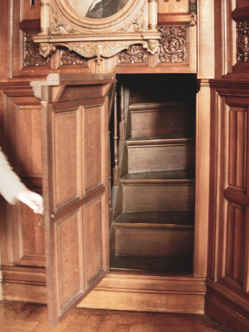 Hidden staircase in a 19th century Victorian home leading to a secret room.